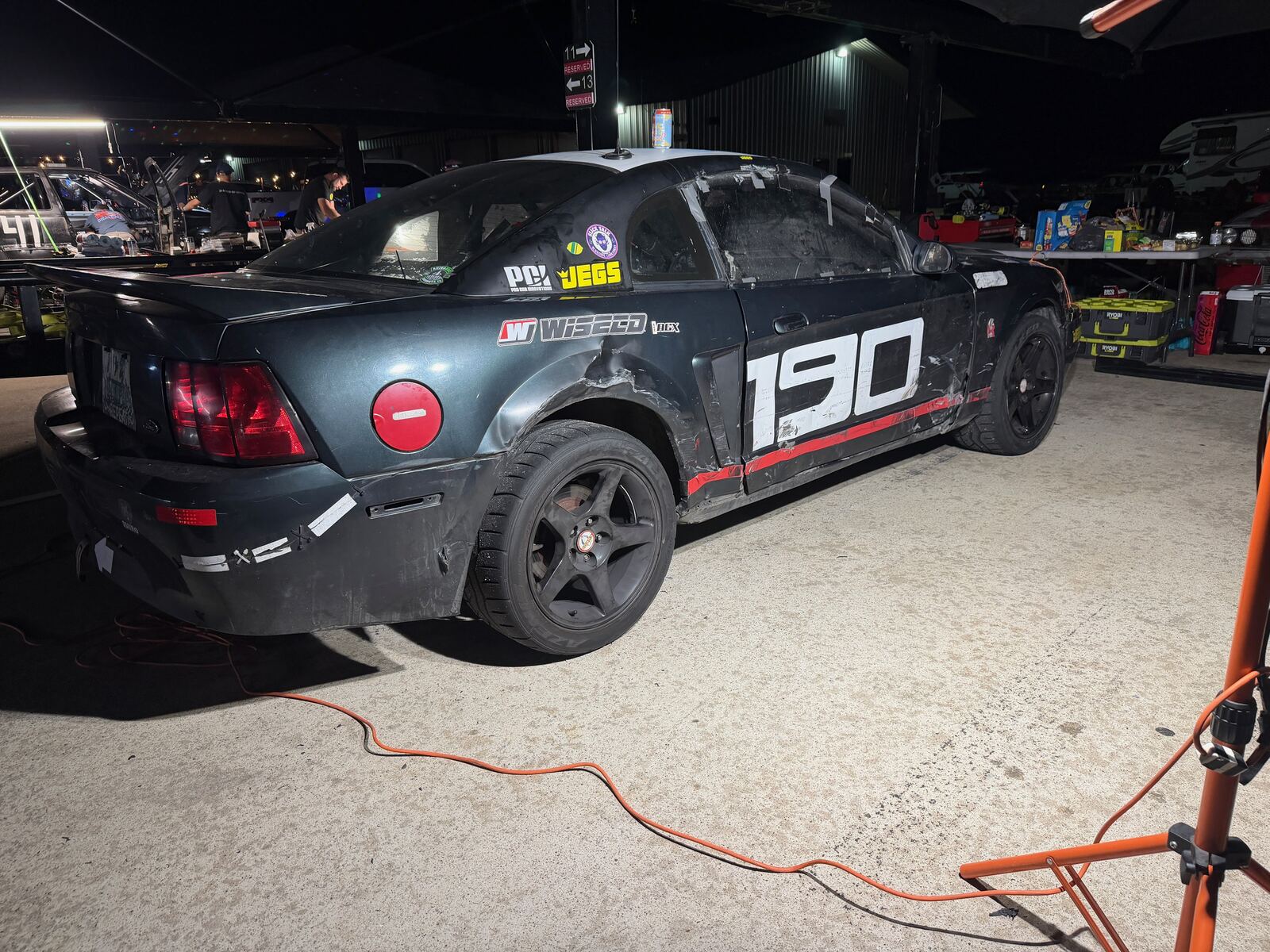 The Lemons car with race damage after a wreck