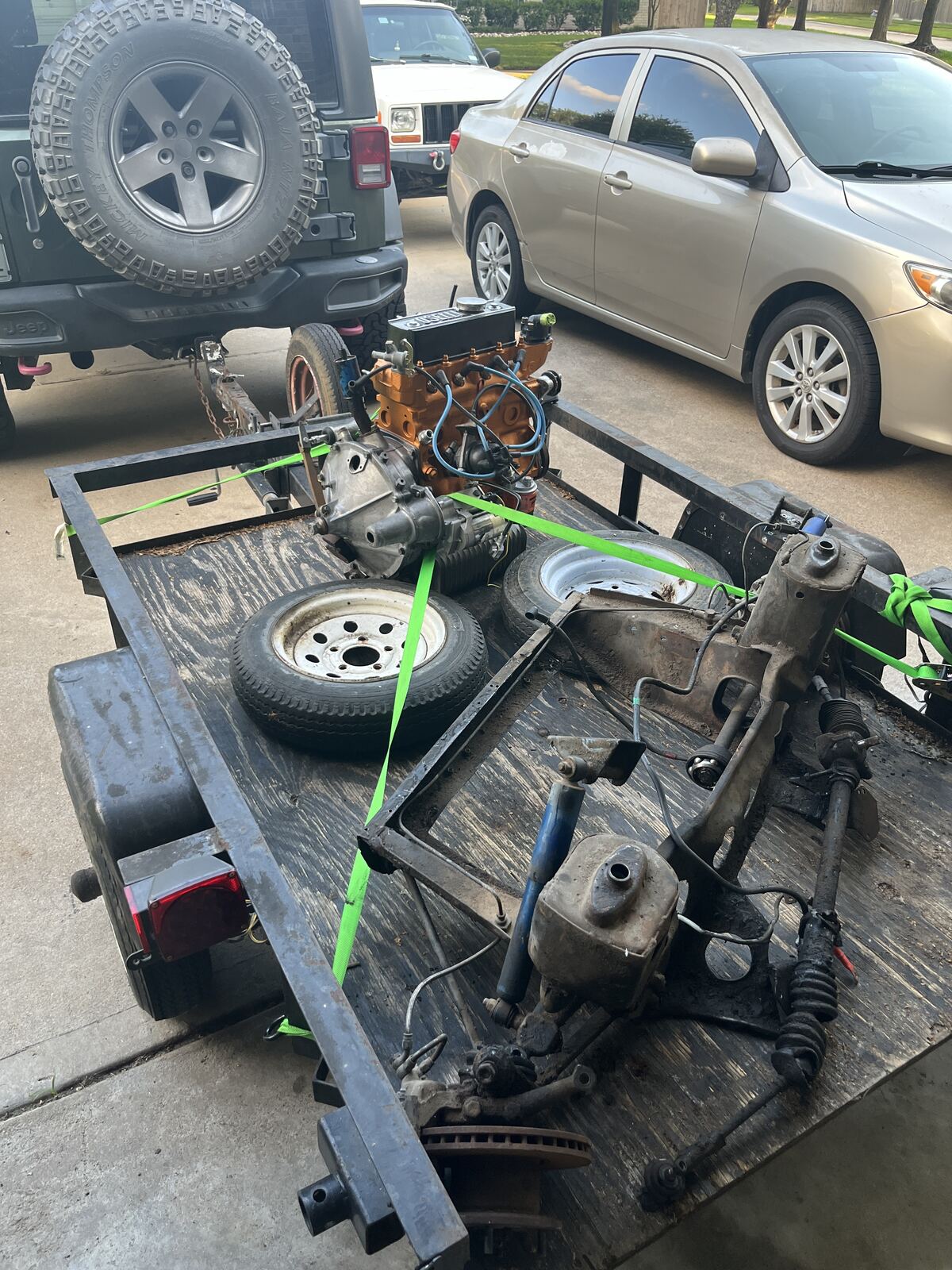 Replacement Mini engine and parts picked up on a trailer