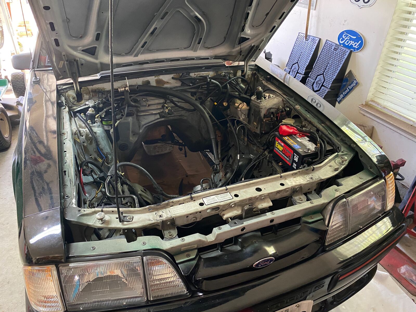 87 Mustang with hood open mid-rebuild