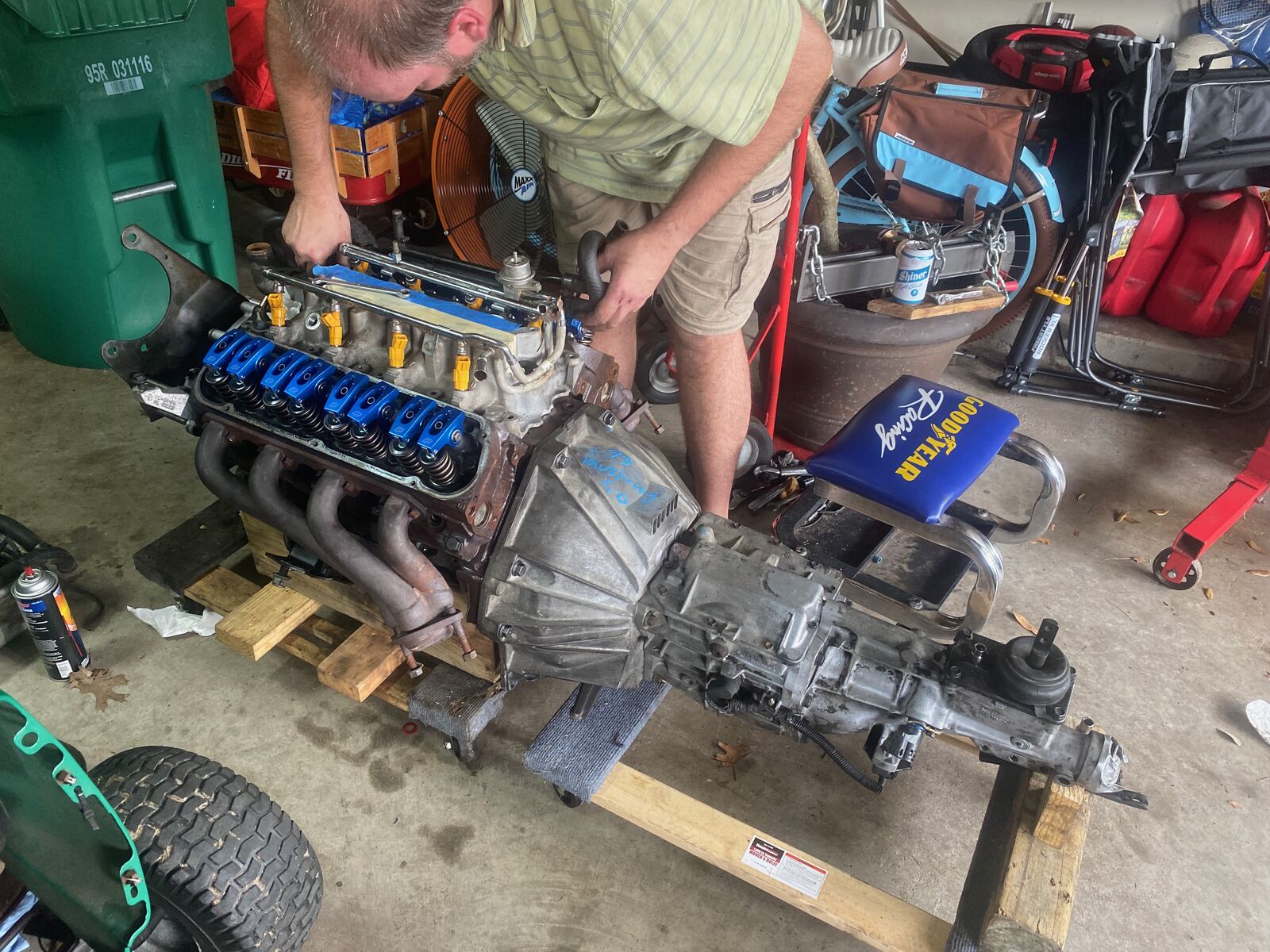 Assembled engine and transmission with headers on the stand